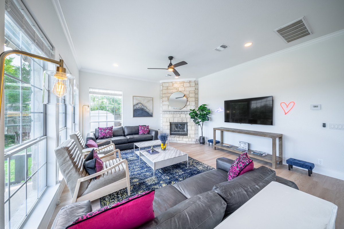 Sunlit living room with sectional seating, perfect for group movie nights.