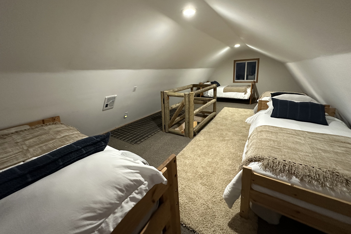 The loft is a cozy space with 4 twin beds... no bunks!