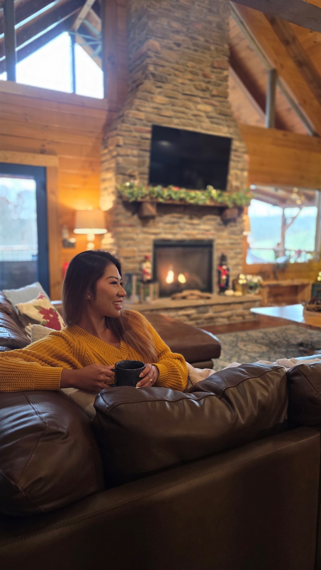 Cozy great room with stone fireplace at a Hocking Hills cabin rental
