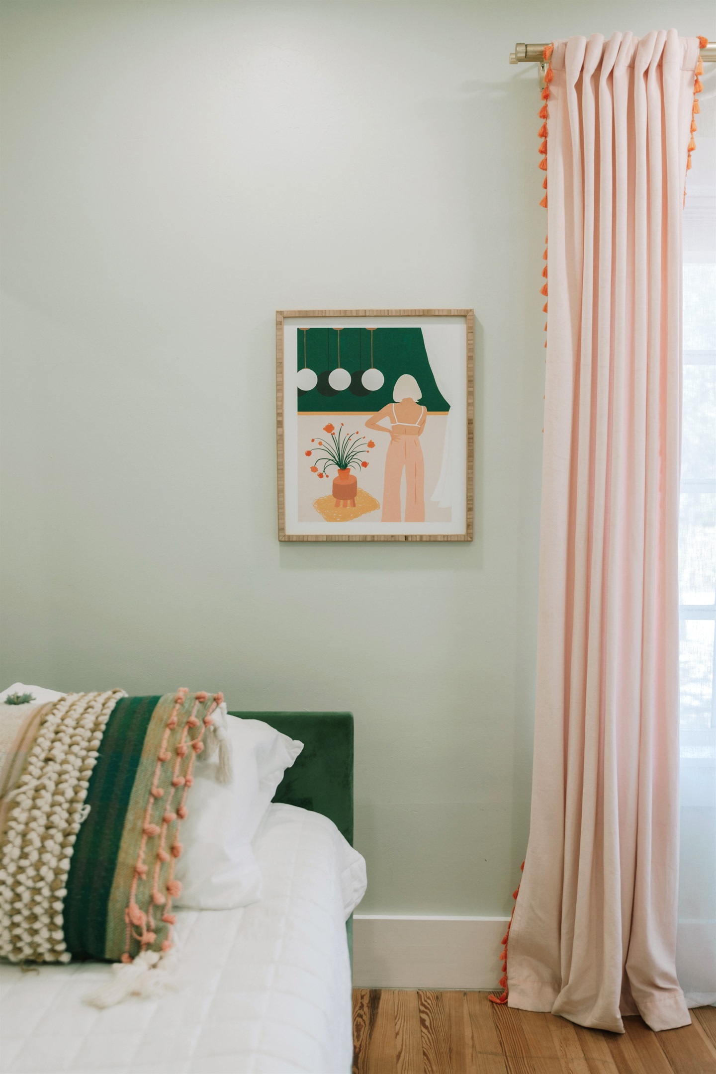 The third bedroom has a daybed and a pullout bed, garnished with colorful art throughout.