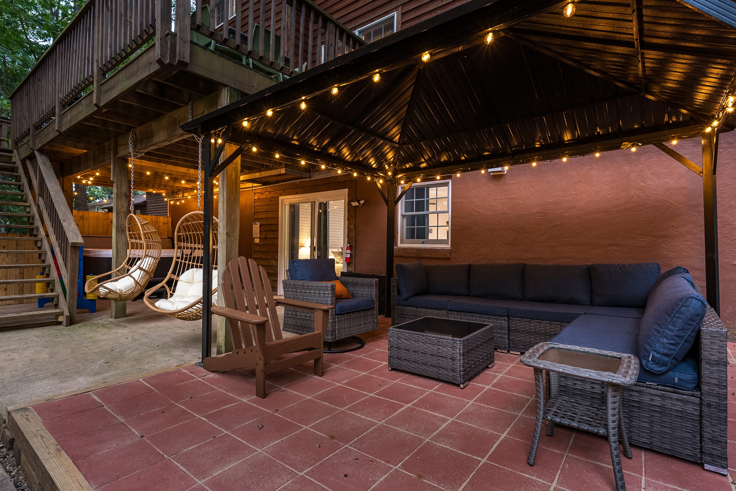 Gather in the shade—this cozy outdoor lounge is the perfect spot for morning coffee or evening chats.