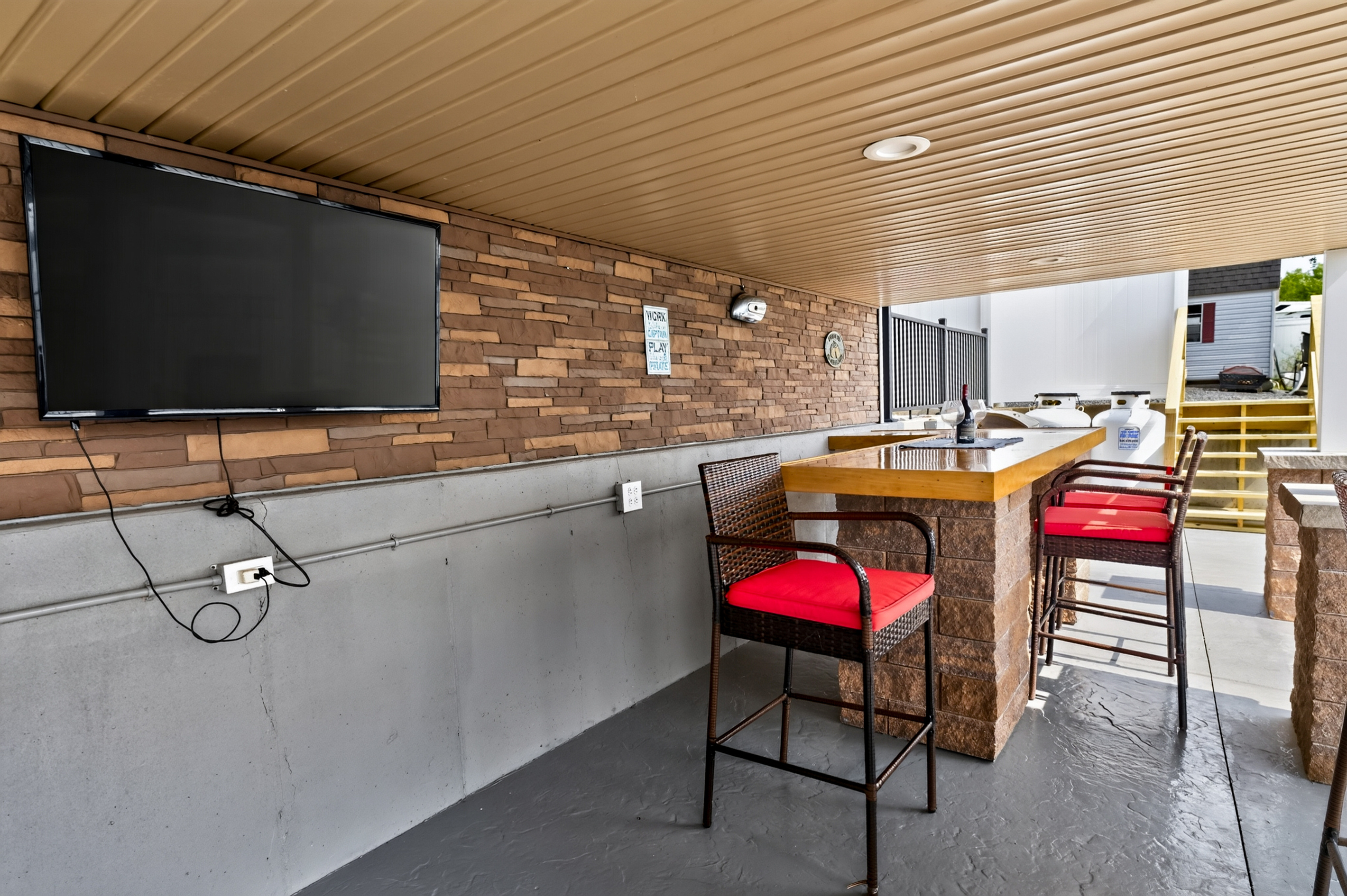 Outdoor bar beside the covered patio