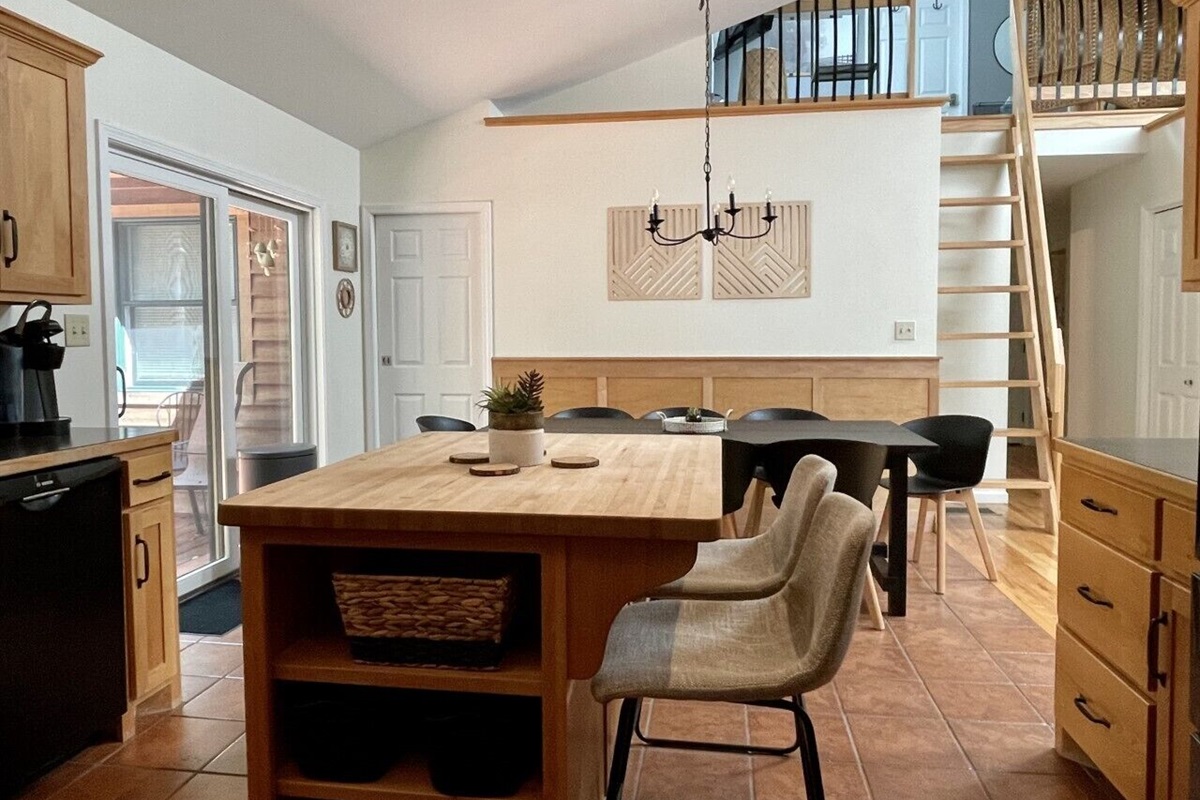 Open kitchen, dining, and living area with tons of natural light
