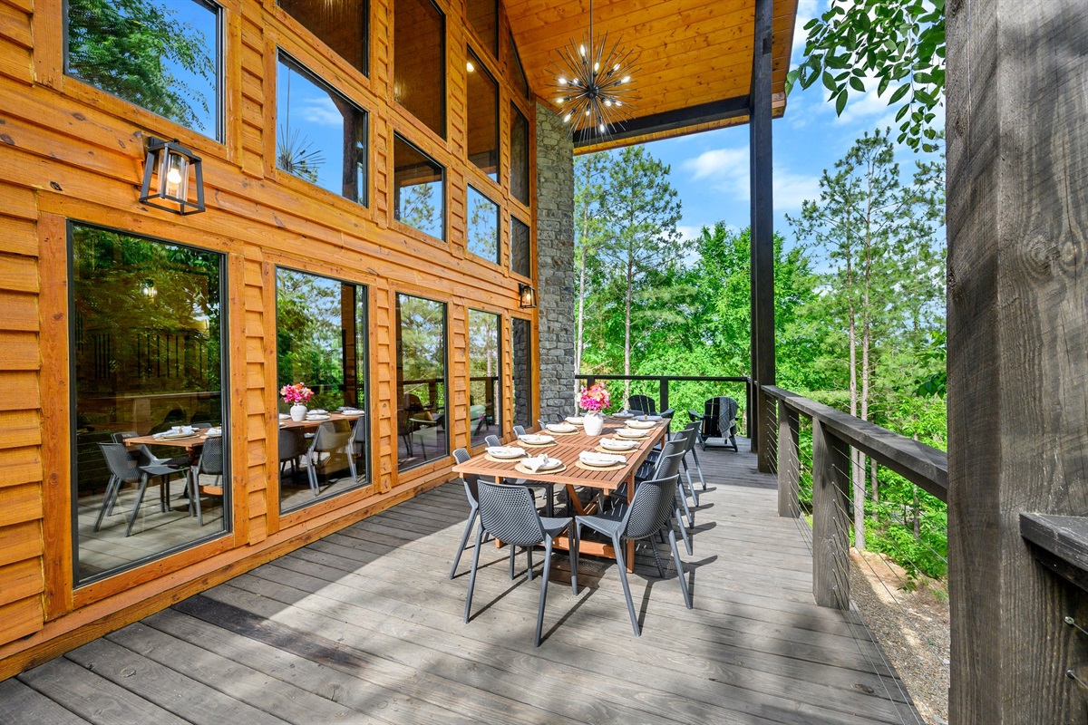 Dine al fresco with forest scenery and warm wood architecture.