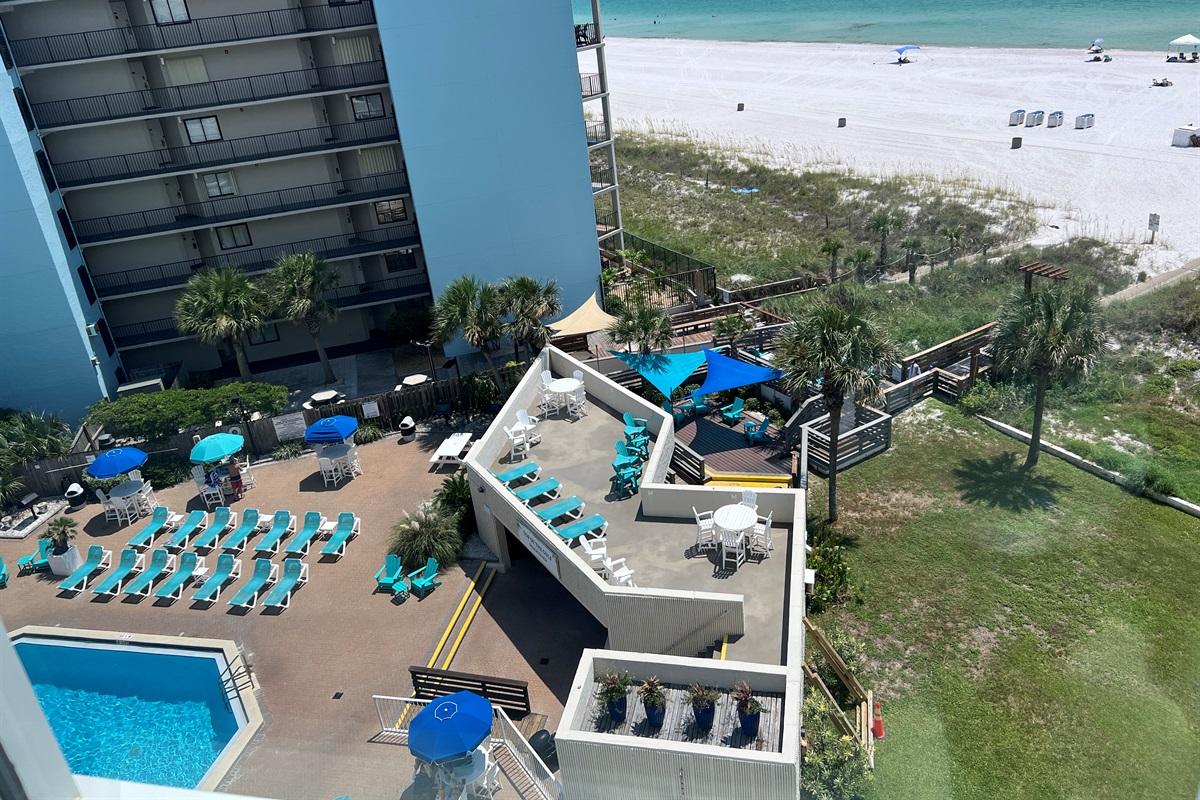 View from condo overlooking the sparkling pools and gulf