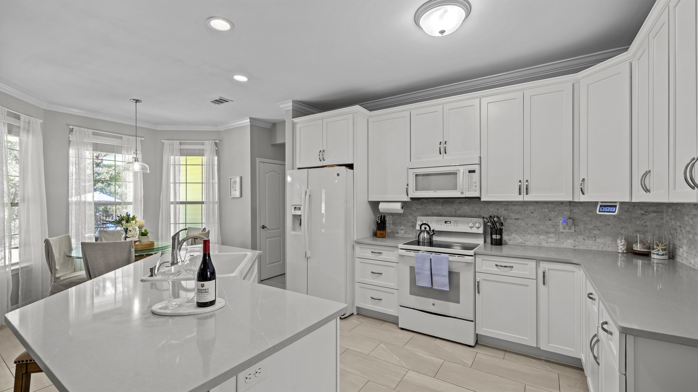 Spacious and fully stocked- this kitchen full of natural light, has everything to make you feel right at home.