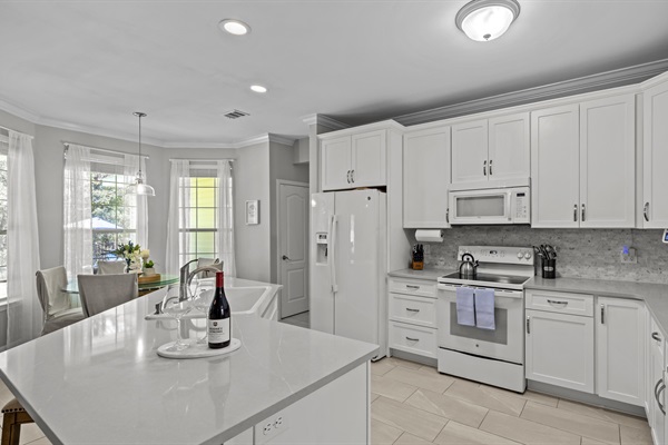 Spacious and fully stocked- this kitchen full of natural light, has everything to make you feel right at home.