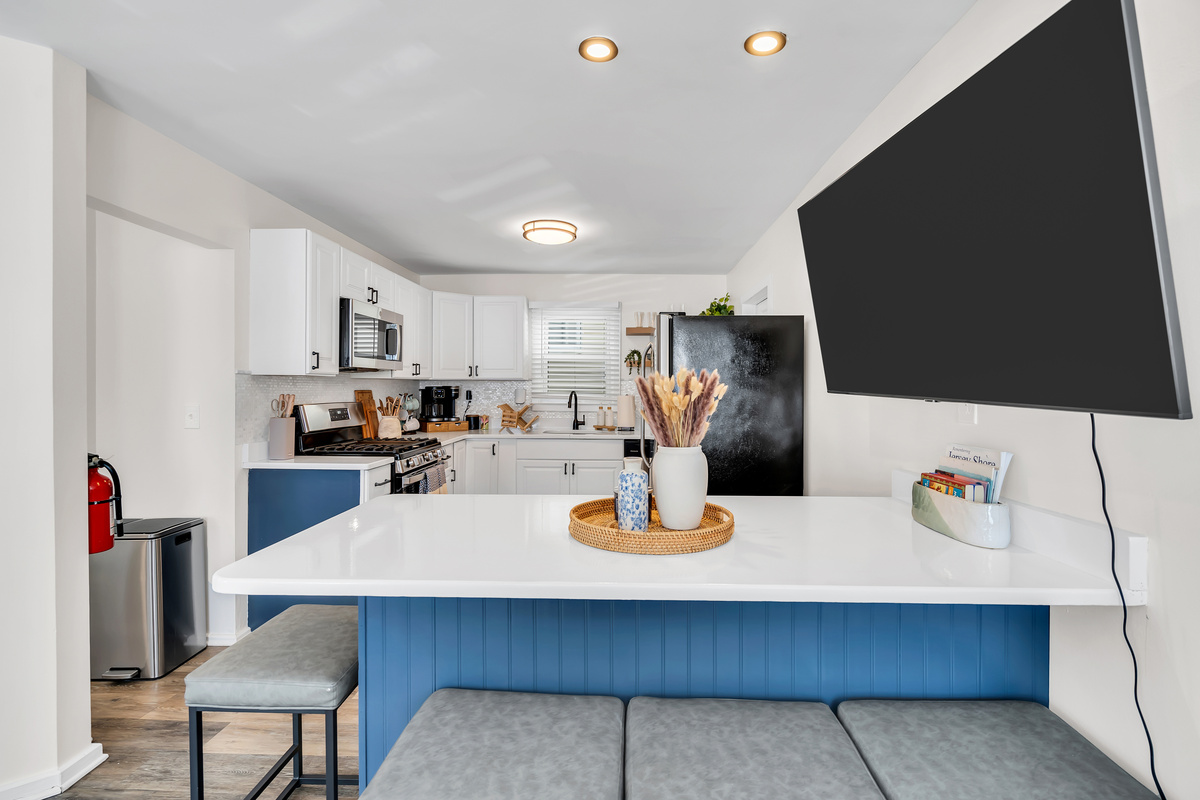 Pull up a stool at the island and keep the cook company. This is where coffee gets poured in the morning and snacks disappear in the afternoon after a solid beach day.