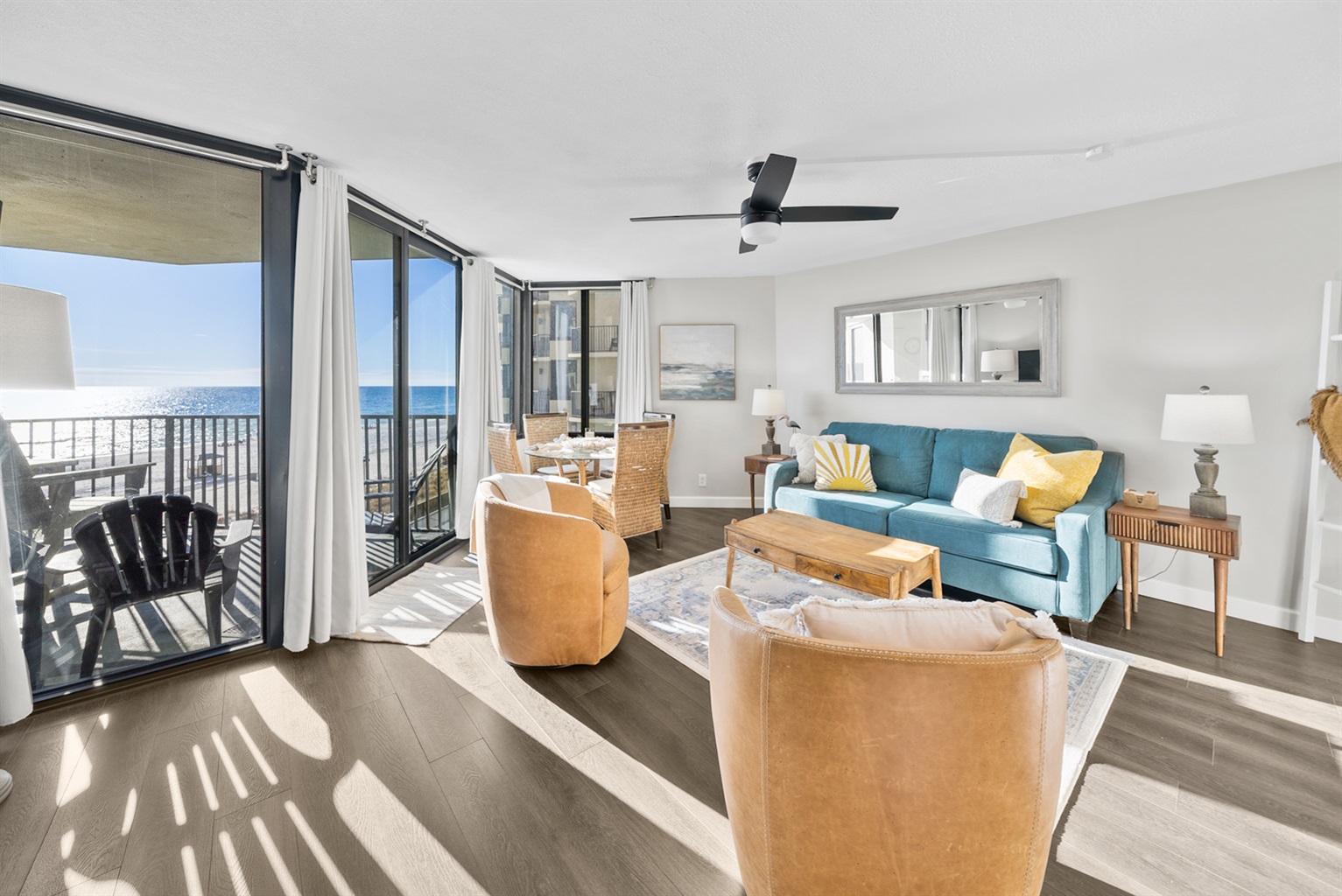 Relax in your cozy beachfront living room — steps from the sand and surf.