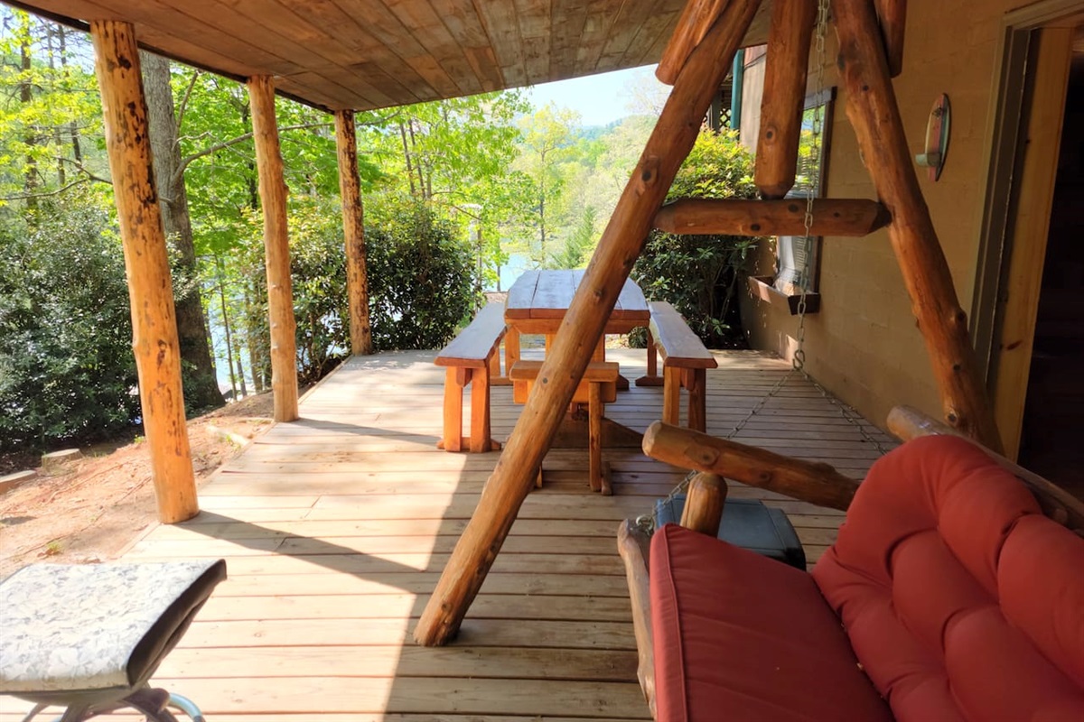 Lower level deck with log swing, 2 picnic tables and exceptional lake/mountain/river views!