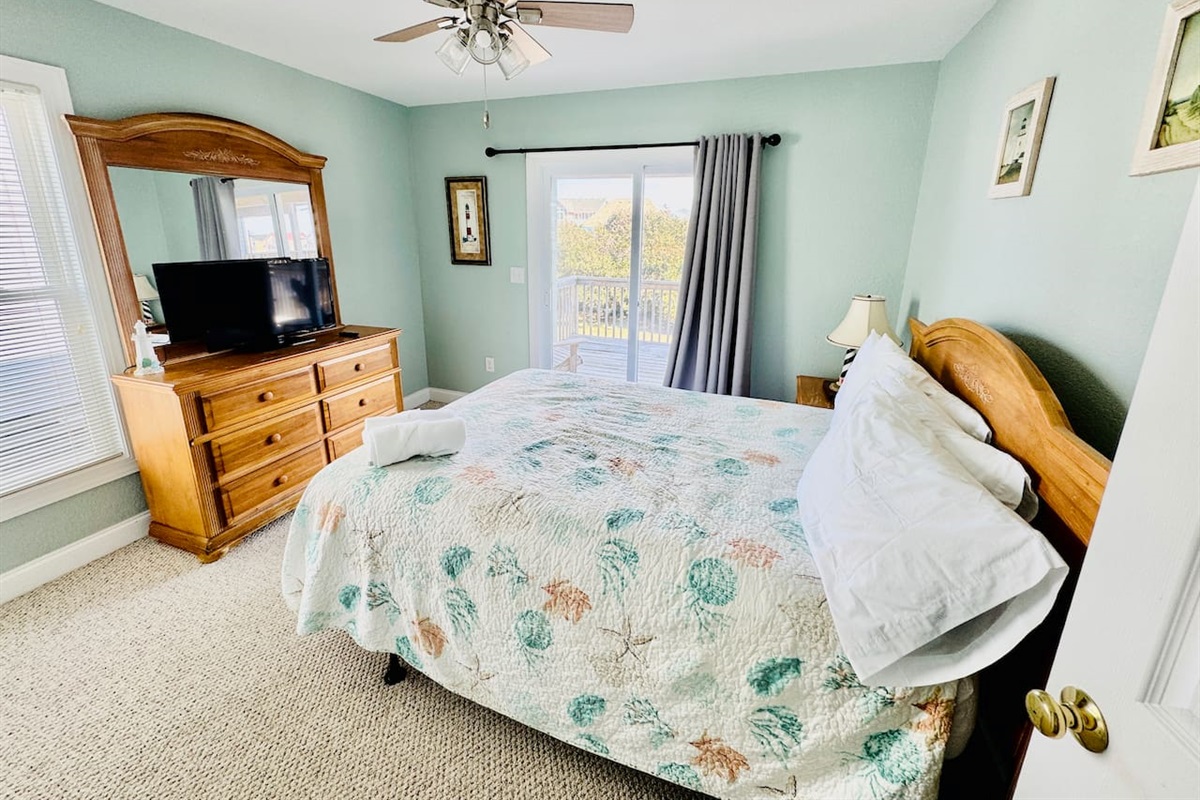 Comfortable Queen bedroom with Smart TV and private deck access.
