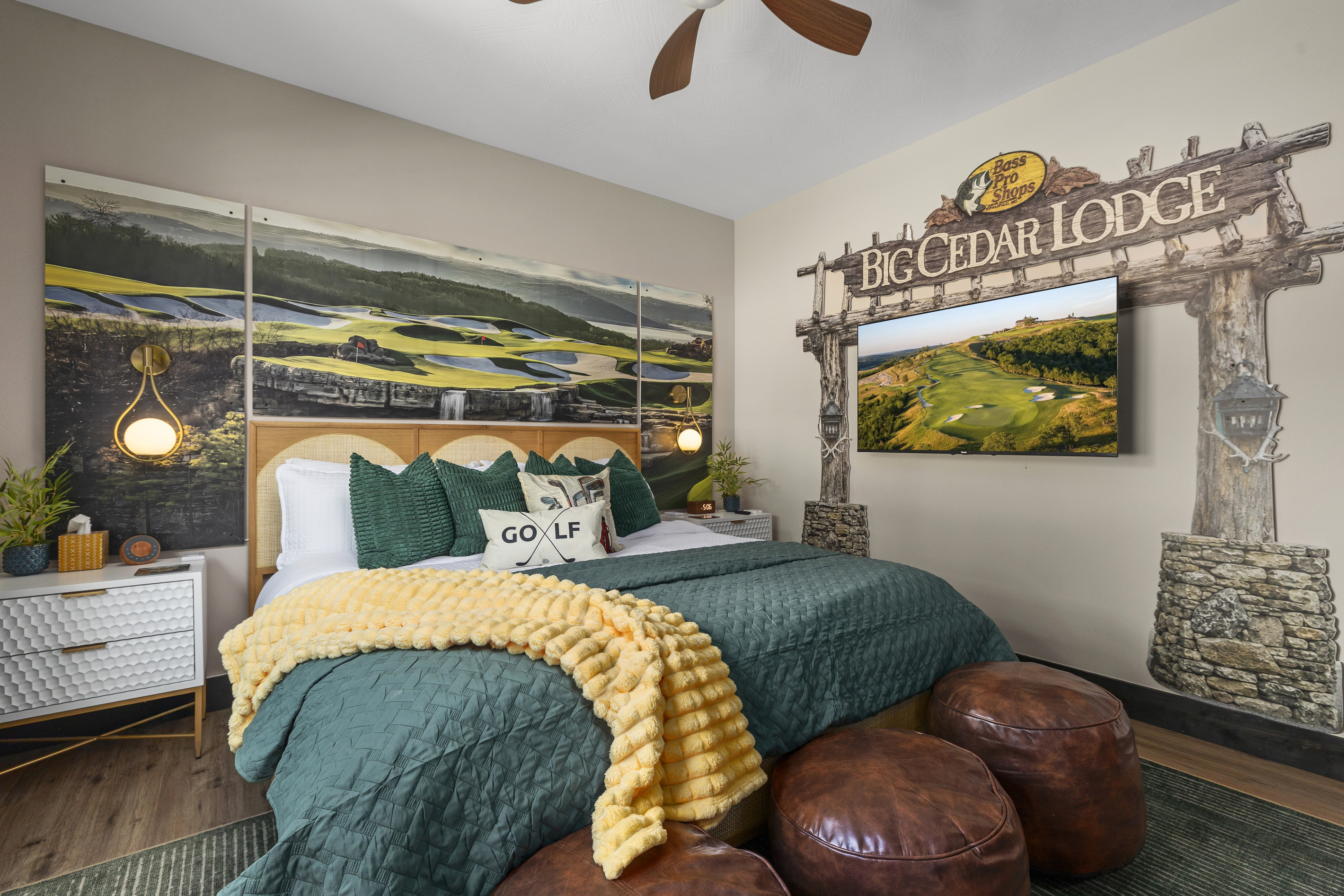 Golf-course murals wrap the room; the TV tees up a round from bed.