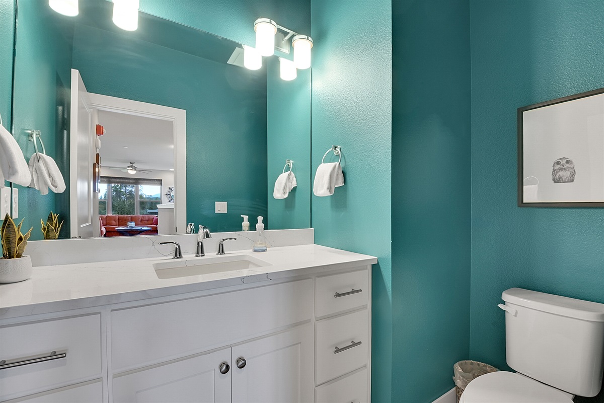 Half bathroom on the main level down the hall from the kitchen/dining area