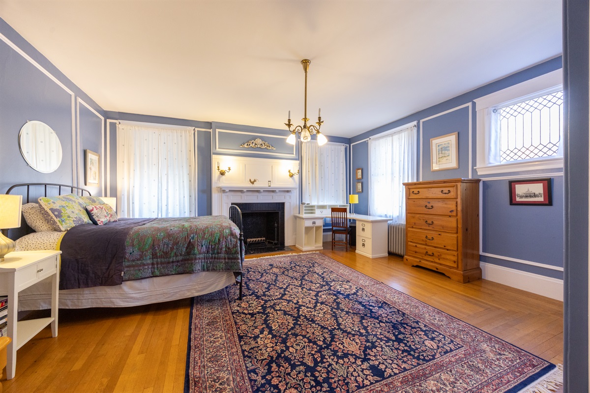 Third bedroom with a queen bed, ample storage, and a peaceful corner to read and relax.