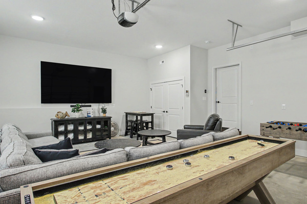 Shuffleboard table and 100" TV