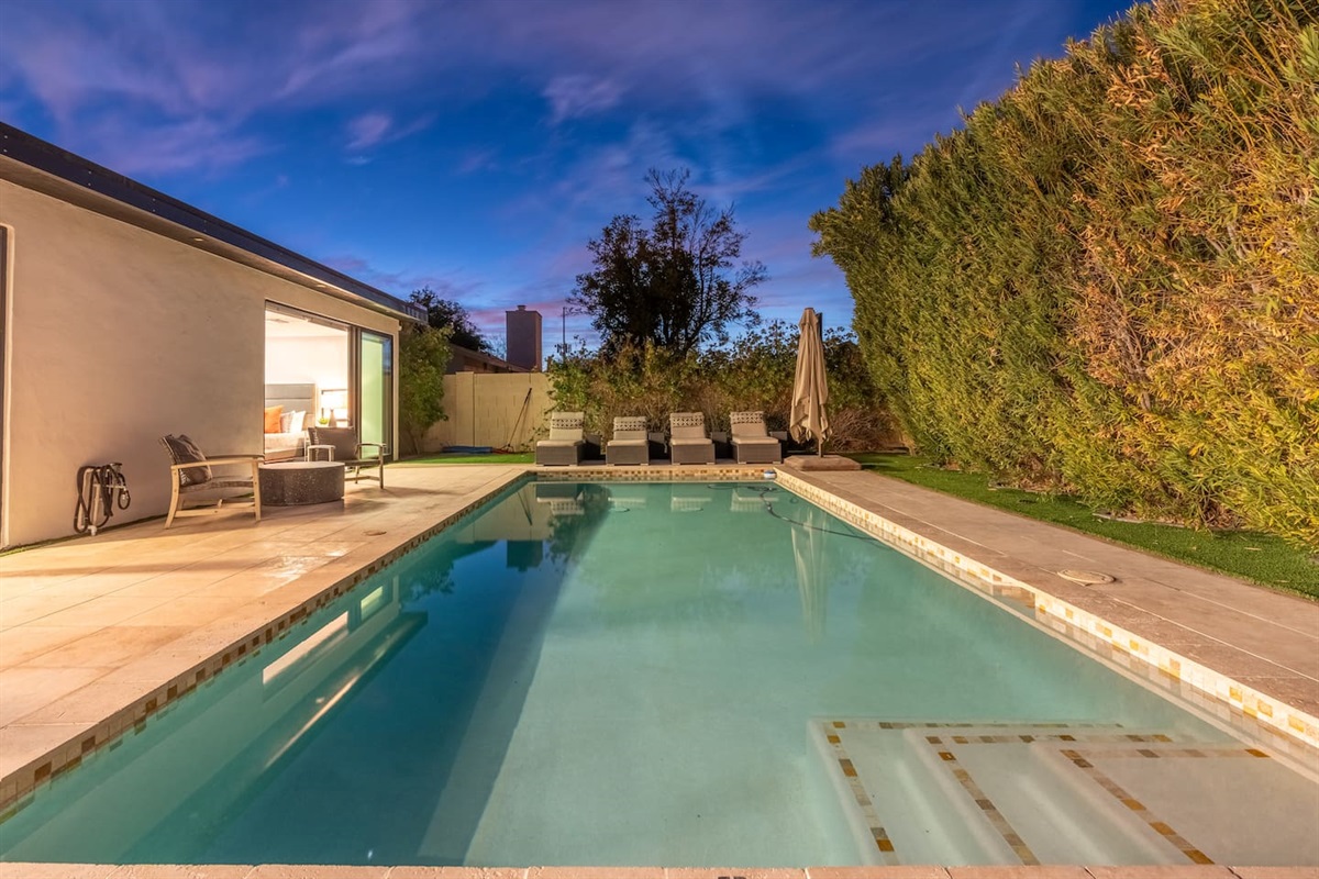 Evening swim with cozy loungers.