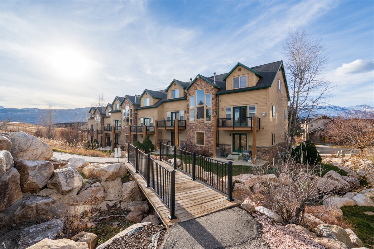 Stroll through beautifully landscaped walkways as you arrive at Hidden Moose Lodge in Moose Hollow.