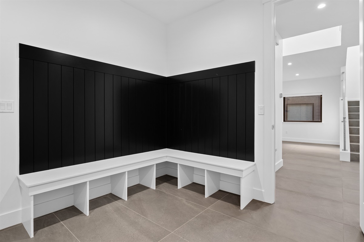 Spacious mudroom with built-in bench seating — perfect for storing coats, boots, and gear after a day on the slopes or lake.