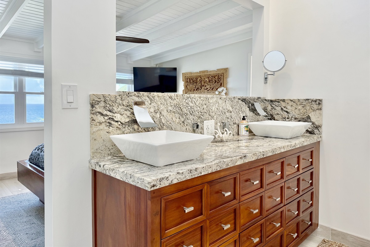 Walk-in shower with luxurious details and natural light.