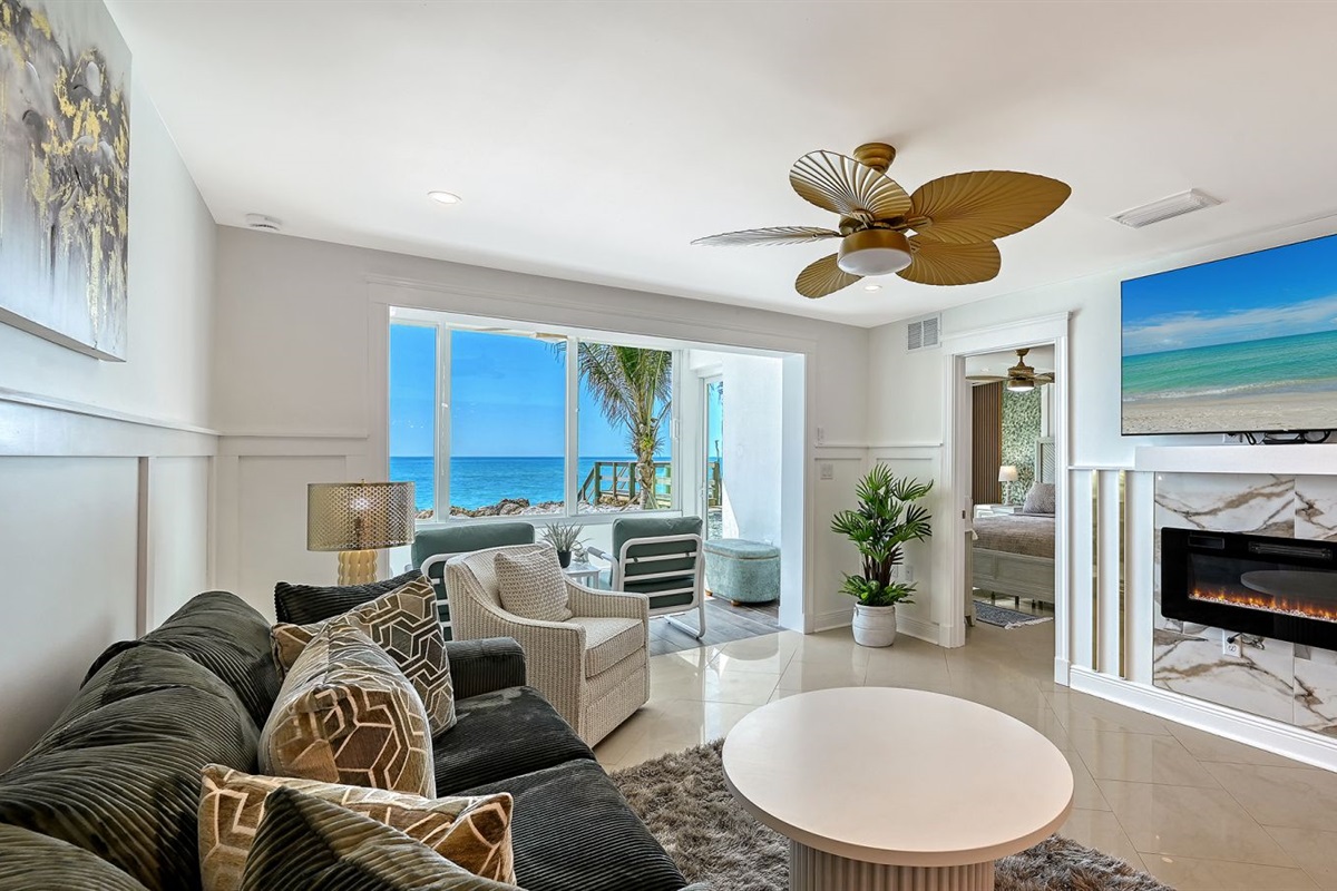 Living room with fireplace -to lanai and master bedroom
