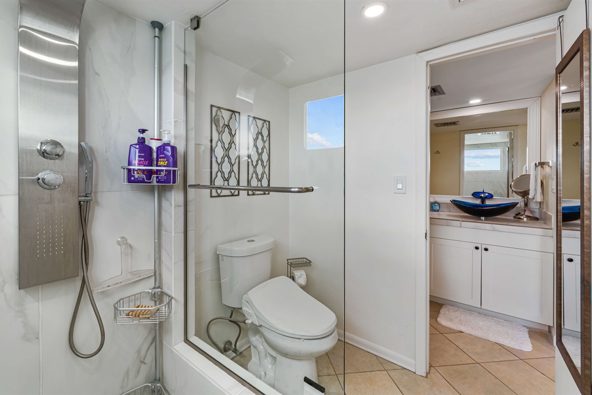 Ensuite bathroom with double sinks just off the primary bedroom
