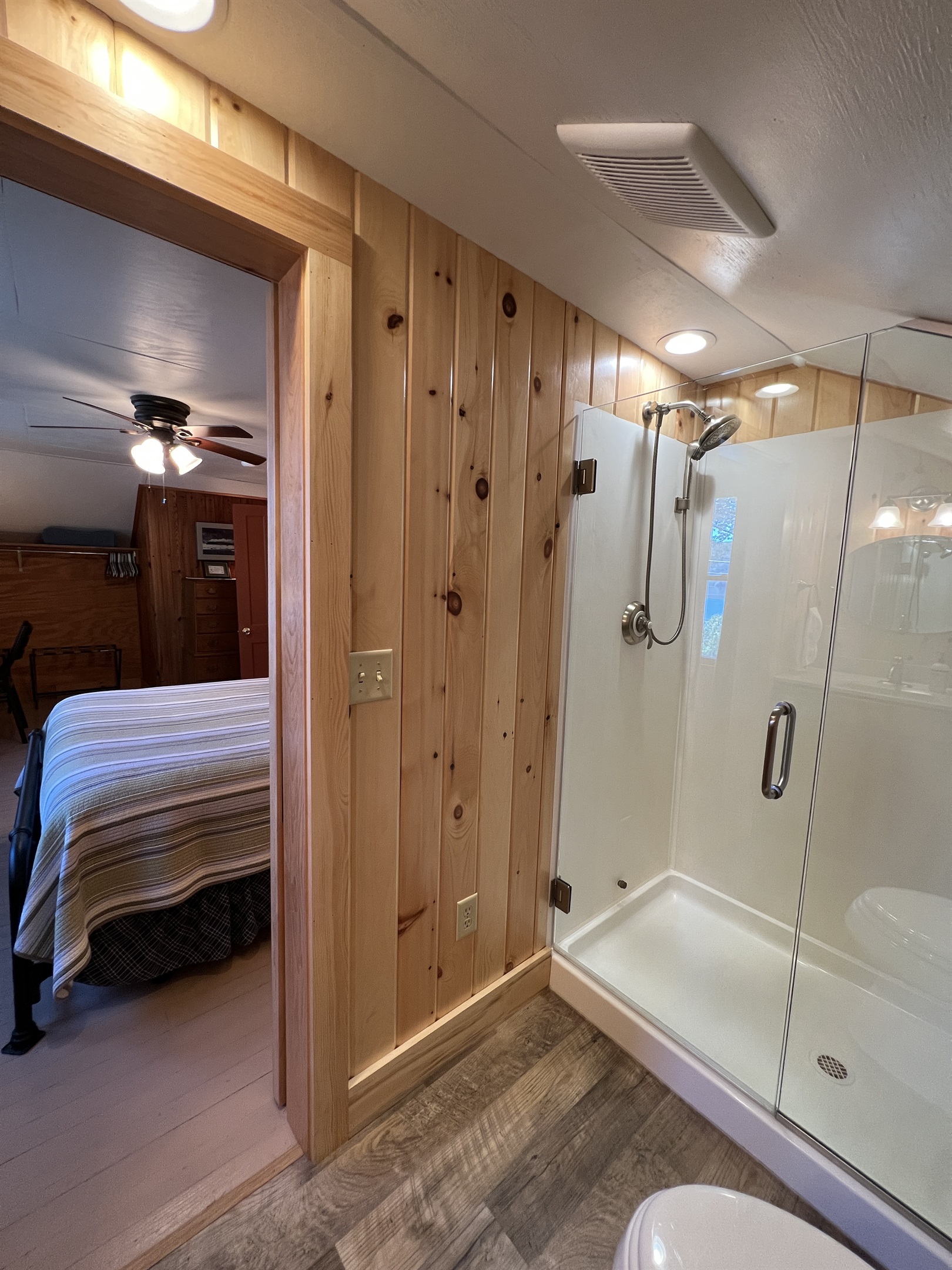Ensuite bathroom with frameless glass shower.