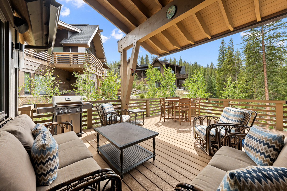 Upper deck off main level with gas grill and ample seating. You will want to sit here and listen to the river all day. 