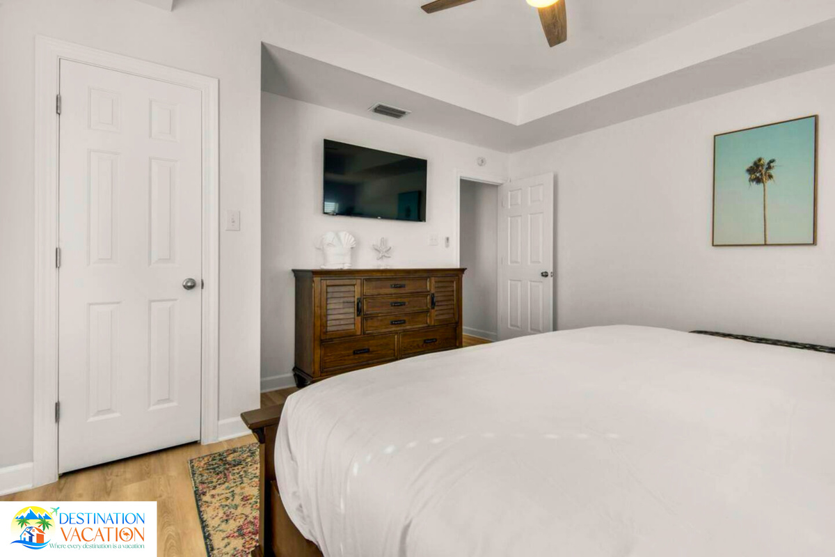 Fresh linens welcome you into coastal comfort.