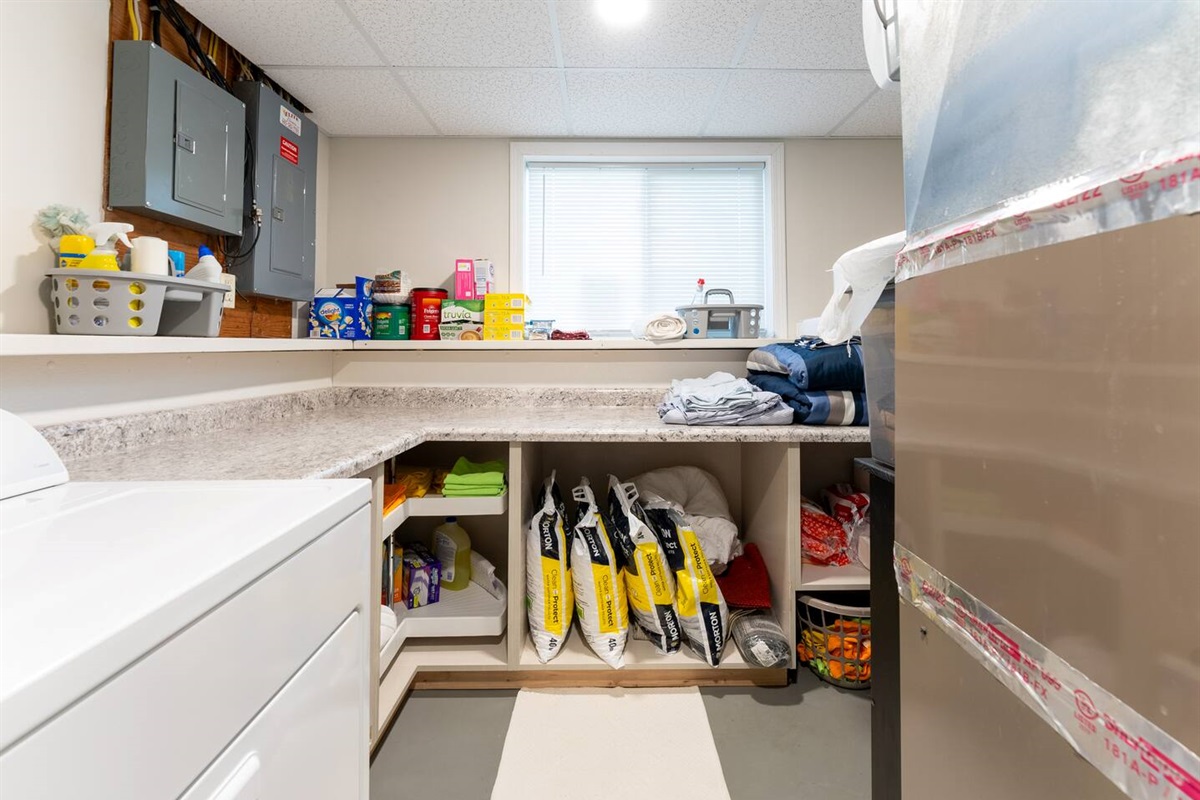 Laundry room with full sized washer & dryer. Lots of counter space!