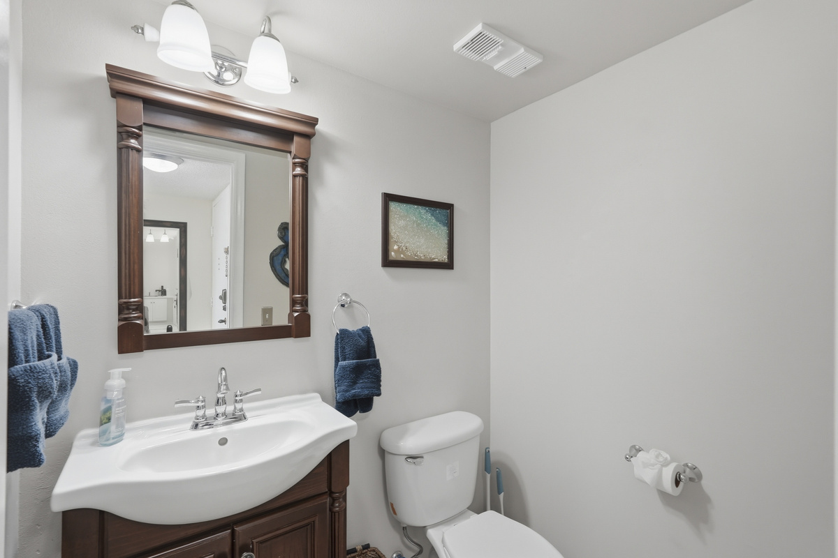 Conveniently located off the main living areas, the half bathroom offers added convenience for guests and features a clean, updated design.