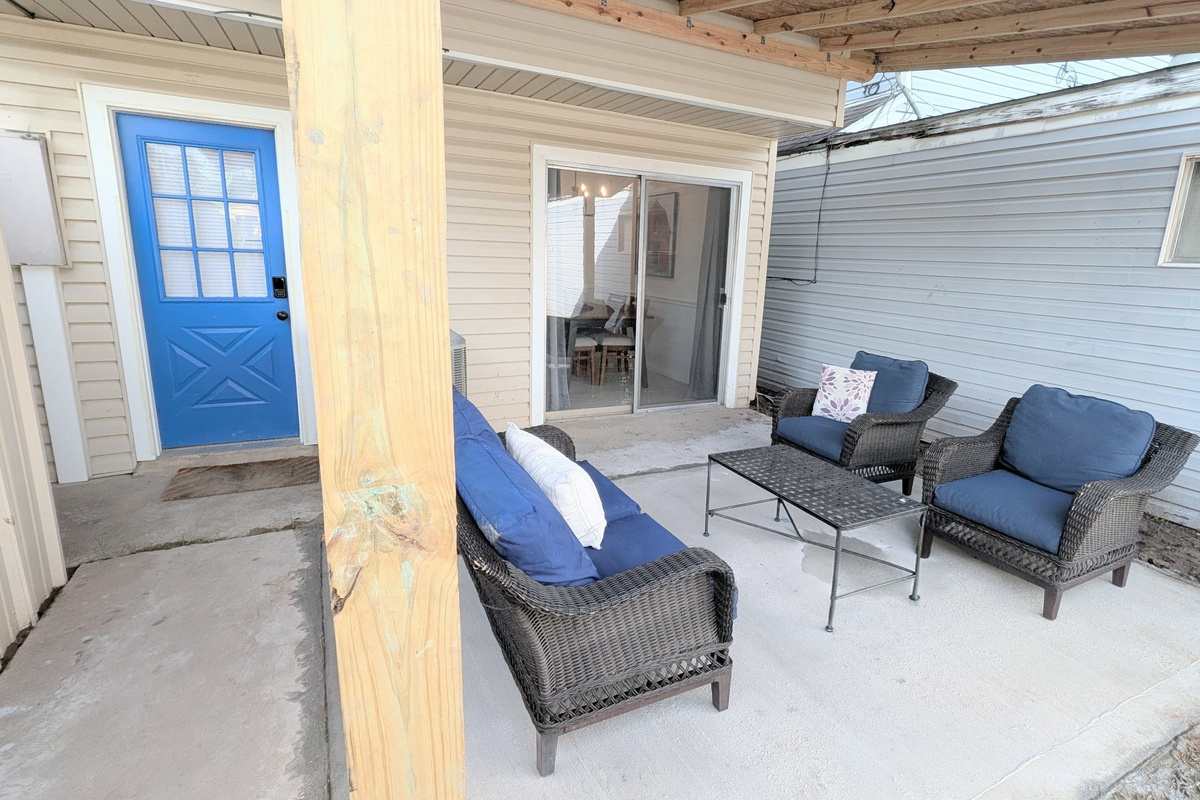 Access the home through the smart lock on the rear entrance and relax under the lights on the large covered patio. 