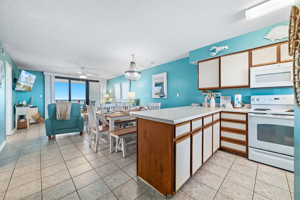 A tidy and functional kitchen countertop. This organized space, complete with coffee makers, a toaster, and a paper towel holder, makes everyday tasks a breeze.