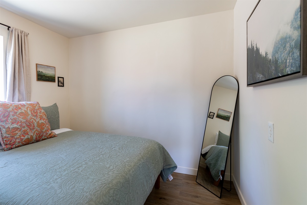 Queen bedroom one with an inviting style
