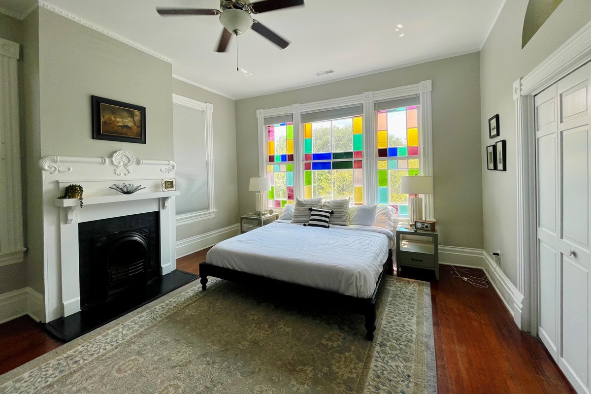 Primary bedroom with ensuite bath is truly a gem.  Stretch out on the king sized bed, enjoying the Savannah sunshine shining through the stain glass windows.  Located on one of the quieter blo