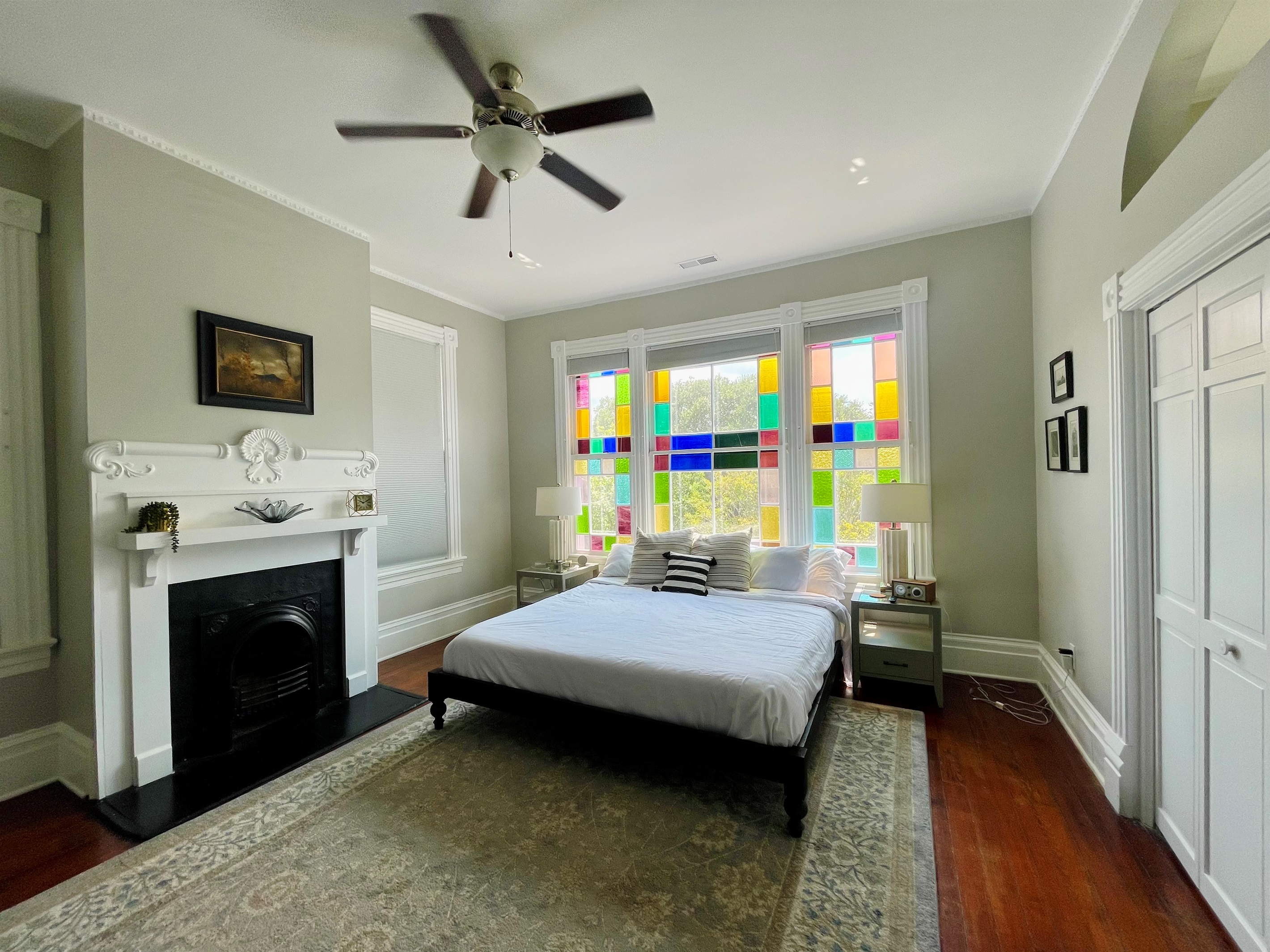 Primary bedroom with ensuite bath is truly a gem.  Stretch out on the king sized bed, enjoying the Savannah sunshine shining through the stain glass windows.  Located on one of the quieter blo