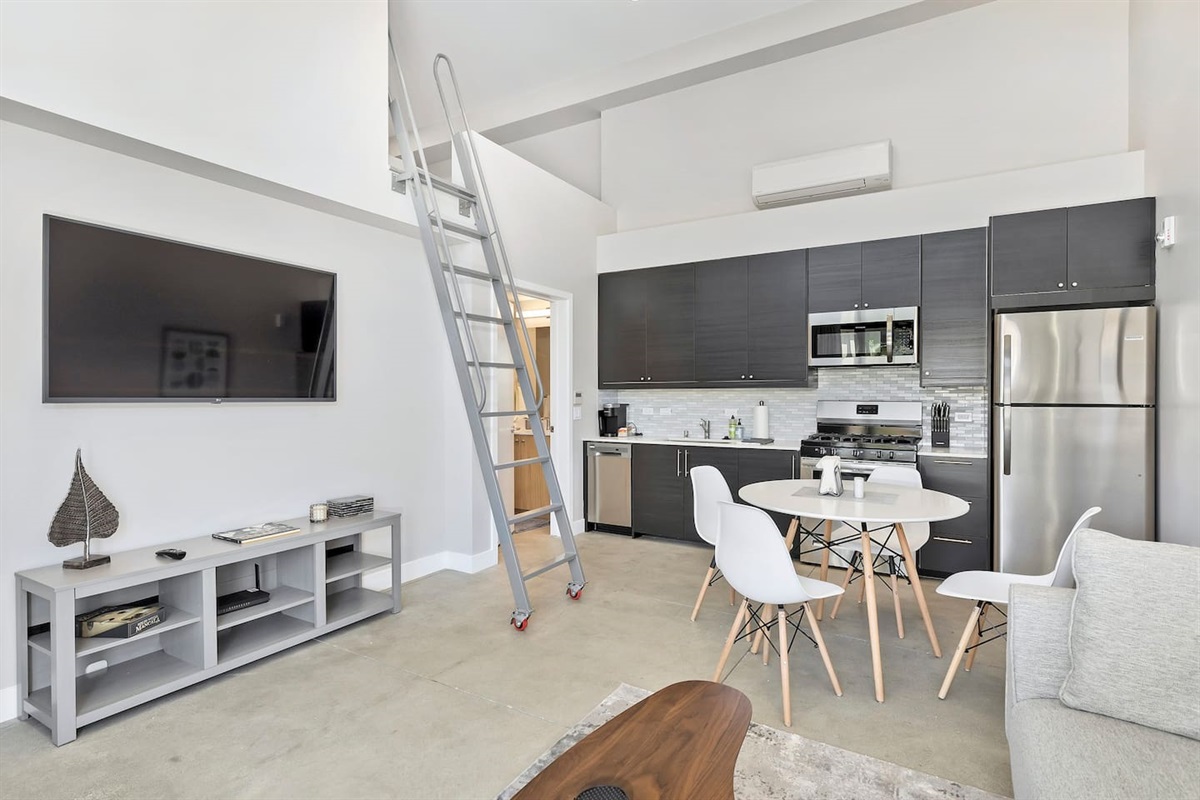 Open and airy 1 bedroom apartment features a semi-private loft space