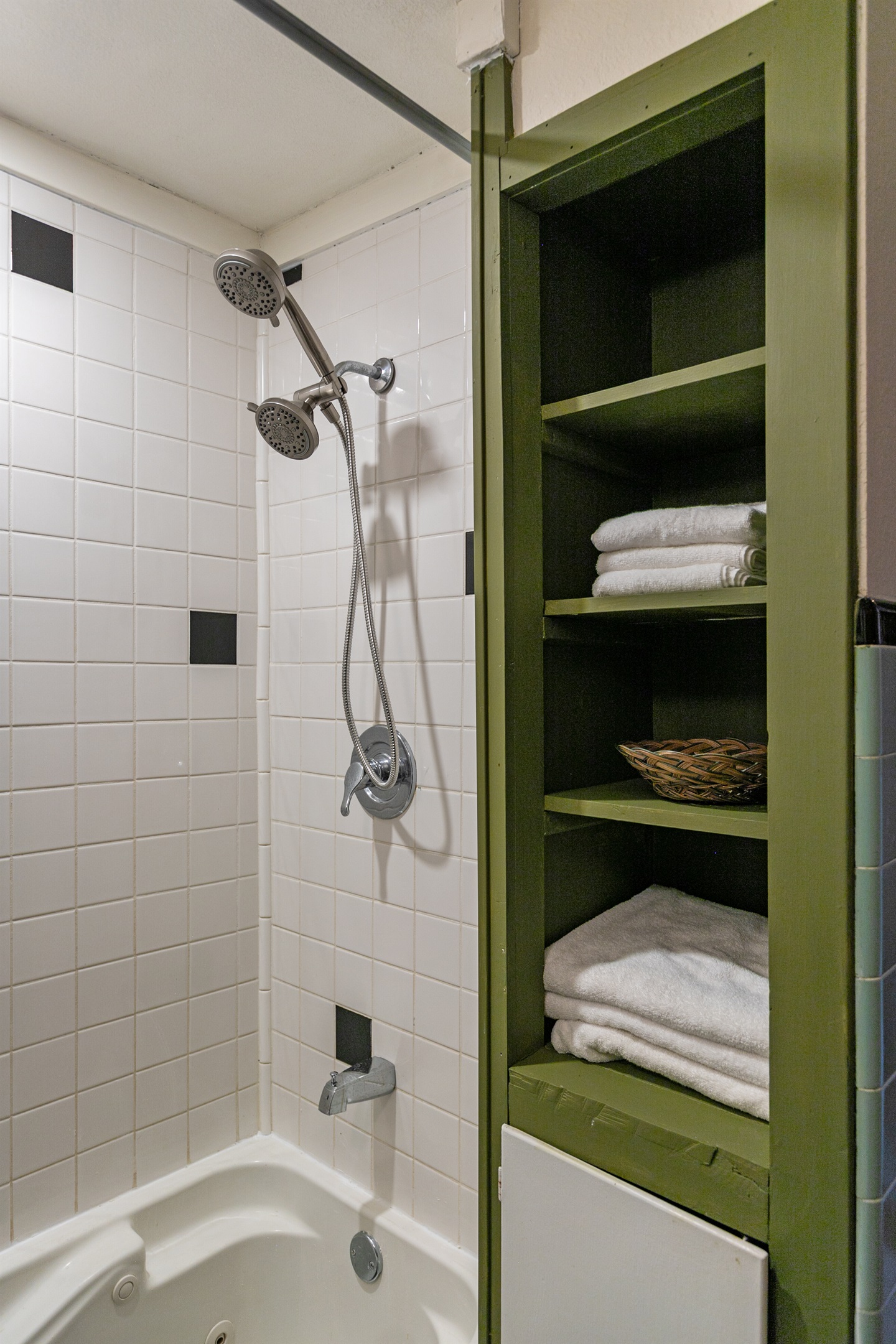 The upstairs bathroom features a walk-in shower with dual shower heads, offering both comfort and convenience.