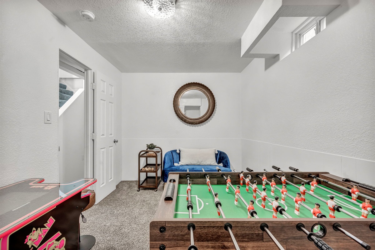 Fun!  Foosball and Pac Man game room.