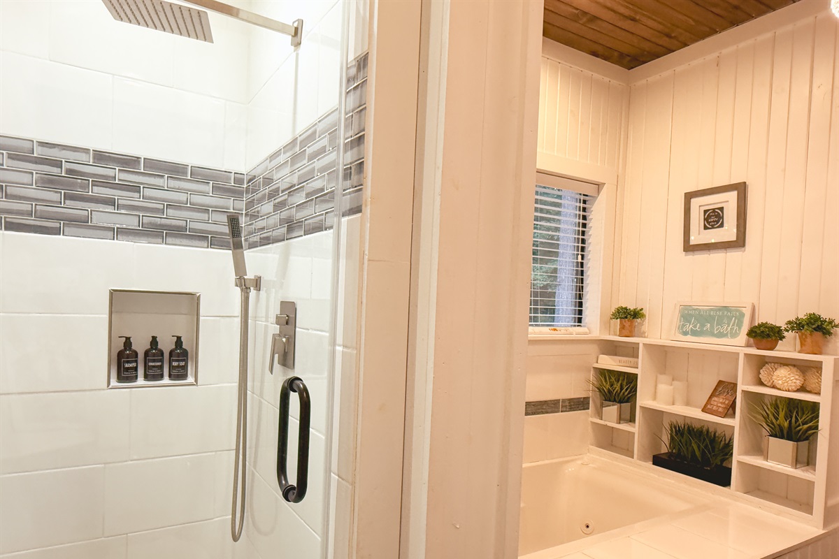 Refresh in the sleek tiled shower, complete with rainfall head and luxurious body products.