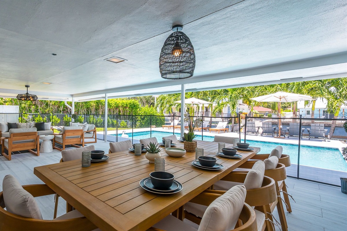 Designed for luxury and comfort, this outdoor space invites you to dine, relax, and unwind in true resort fashion. Enjoy poolside loungers, shaded patio seating, and an ambiance that blends modern elegance with the ease of Florida living