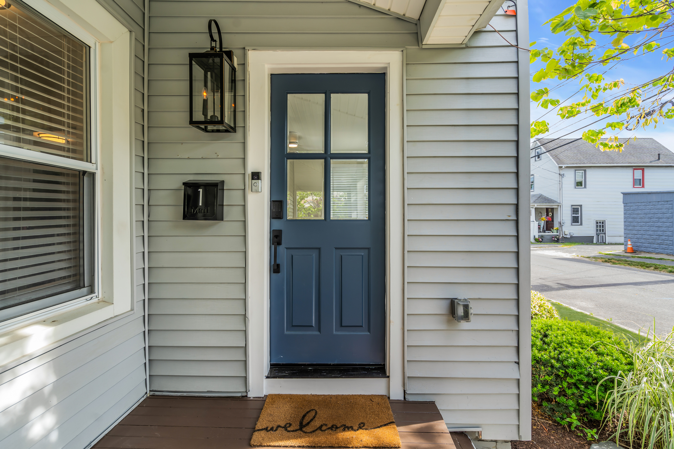 Let yourself in with the keypad, no key handoff needed. The navy front door and private entrance make every arrival simple, even after a late drive in.