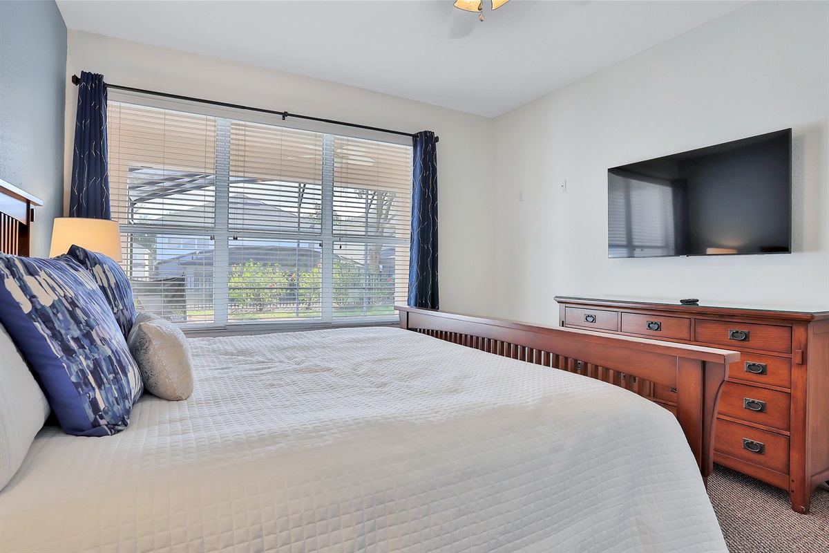 Primary King bedroom suite with 55" TV. Now with luxury vinyl flooring.