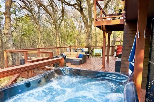 800 sf Deck | Tabletop Fire Pit (Propane Provided) | Outdoor Cooler | Private Hot Tub for 4 people with Speaker | Private Wooded Views | String Lights
