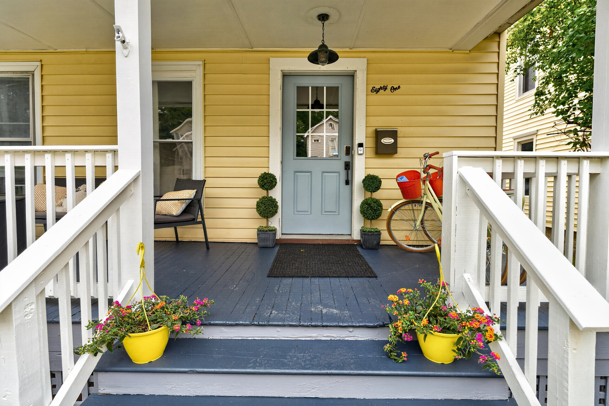 Front entrance with steps and flower planters