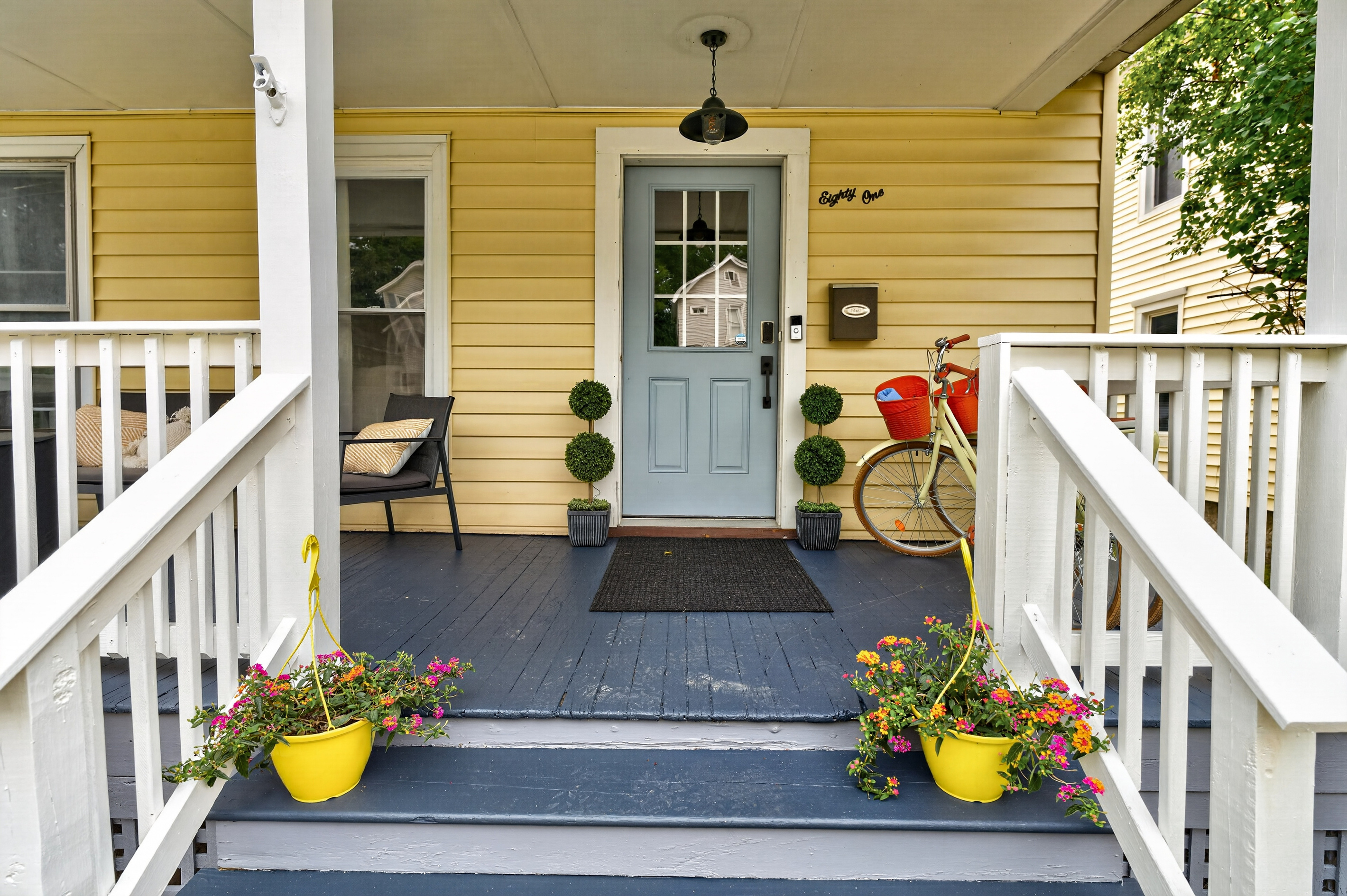 Front entrance with steps and flower planters