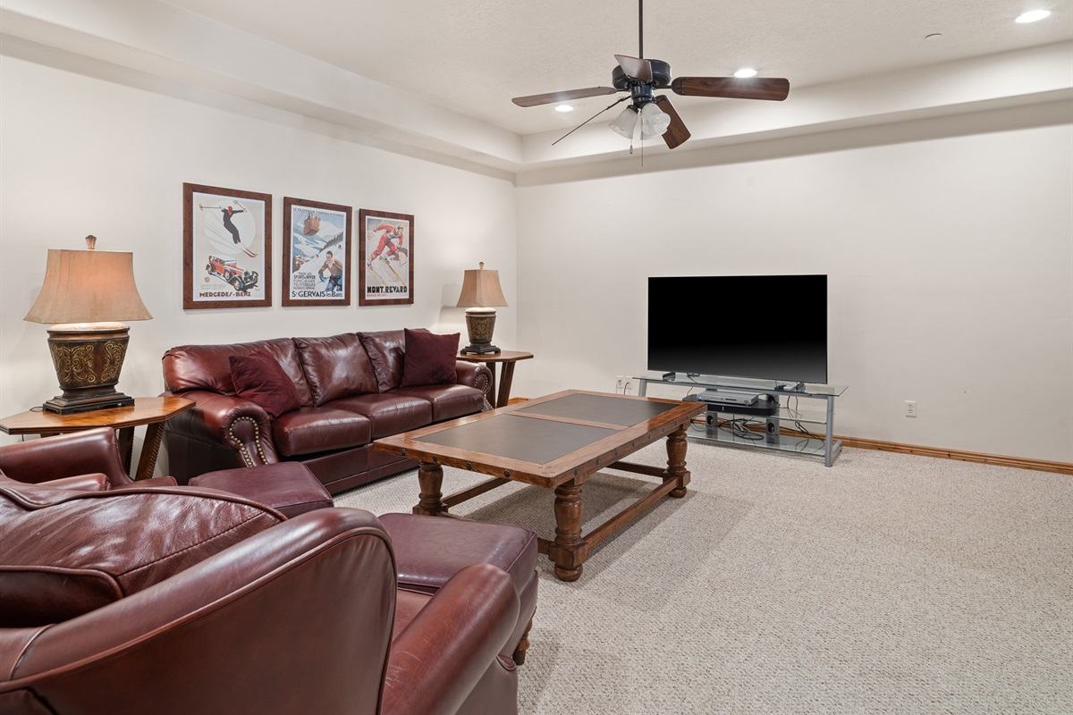 Lounge space with large TV—perfect for movie nights