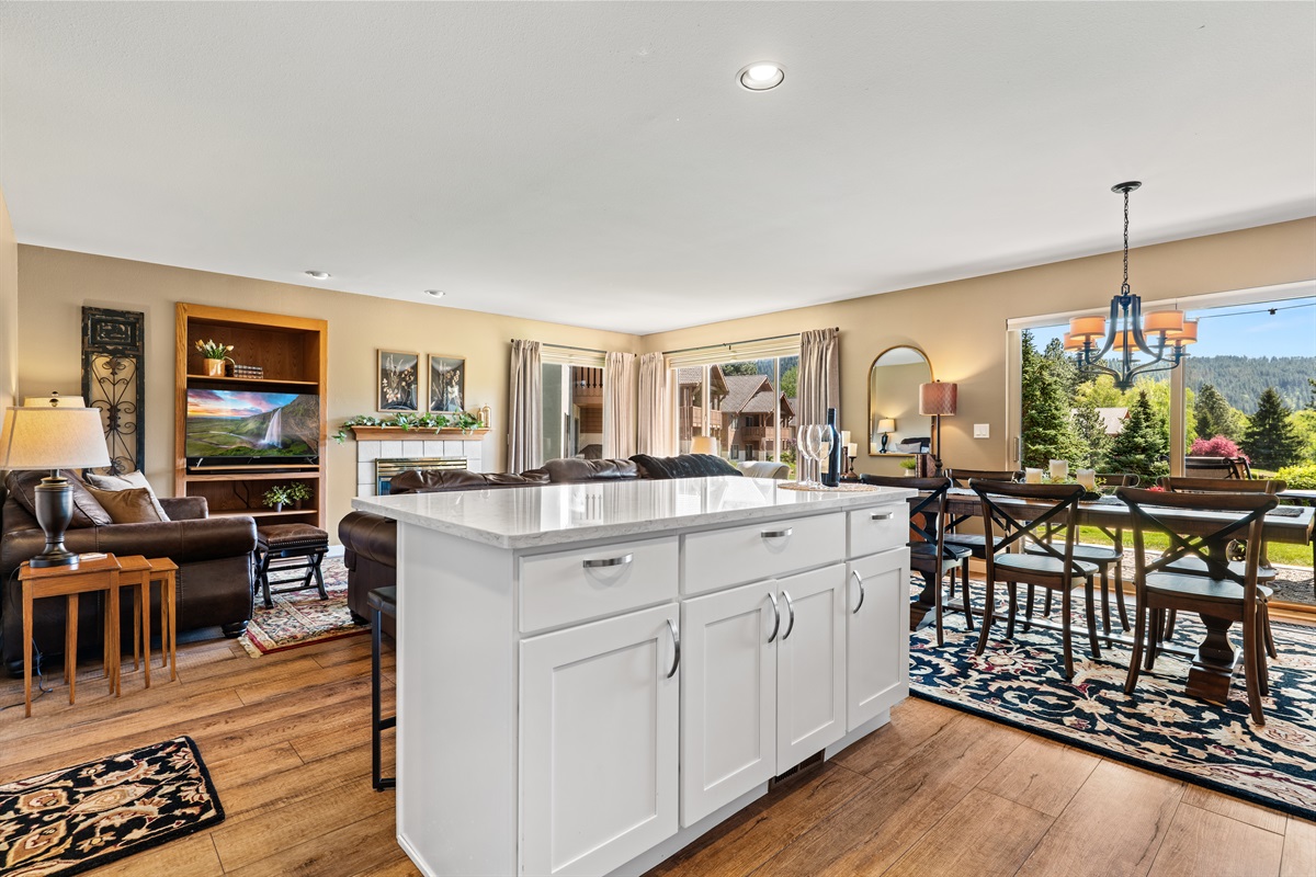 Kitchen island with view of living and dining rooms