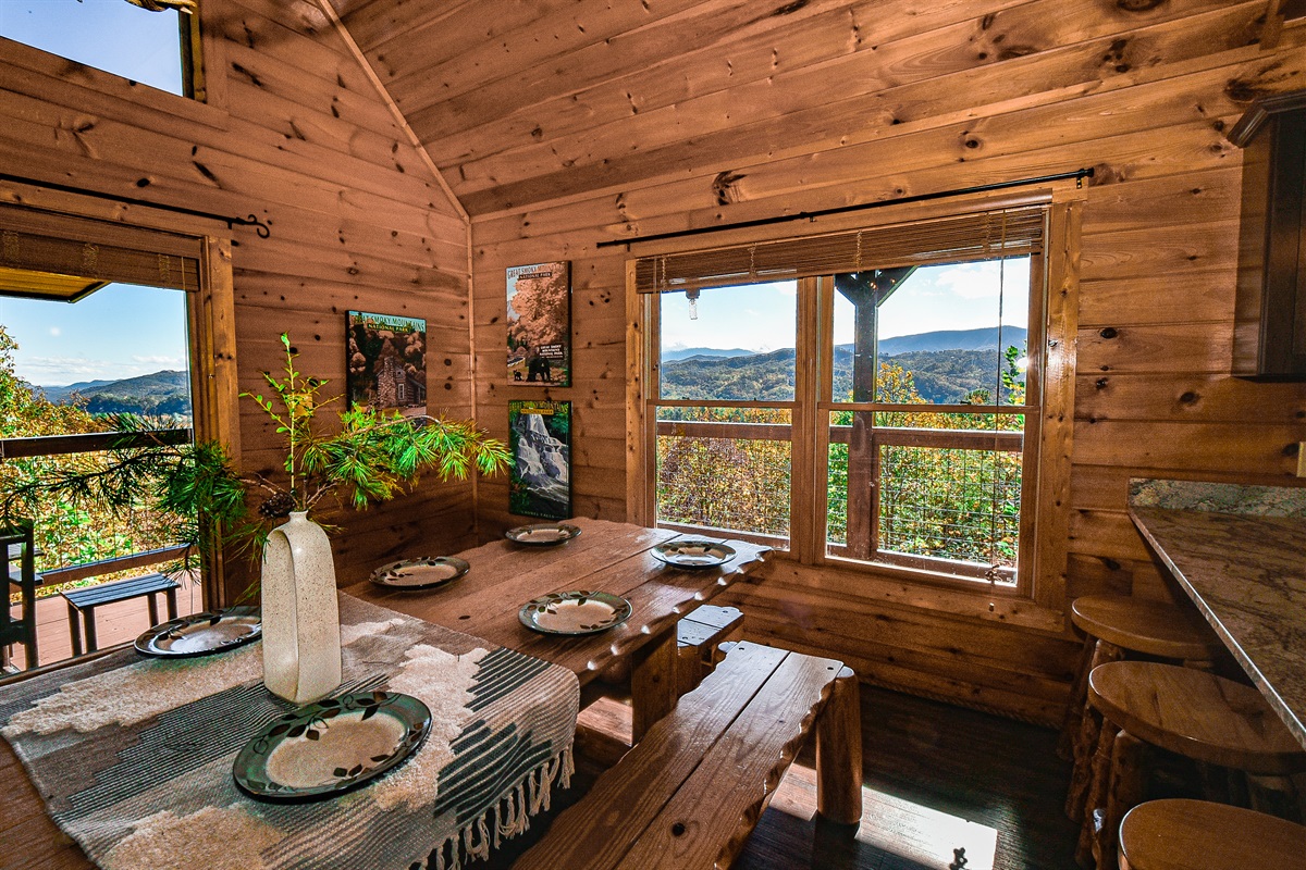 Extra large dining table and bar seating area with a view is the perfect spot to mingle and take in the Great Smoky Mountains.