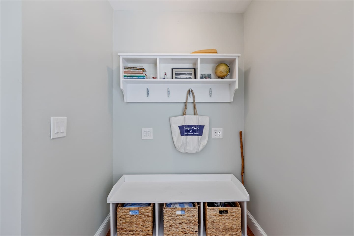 To the right of the door is a cubby space for all the beach necessities 