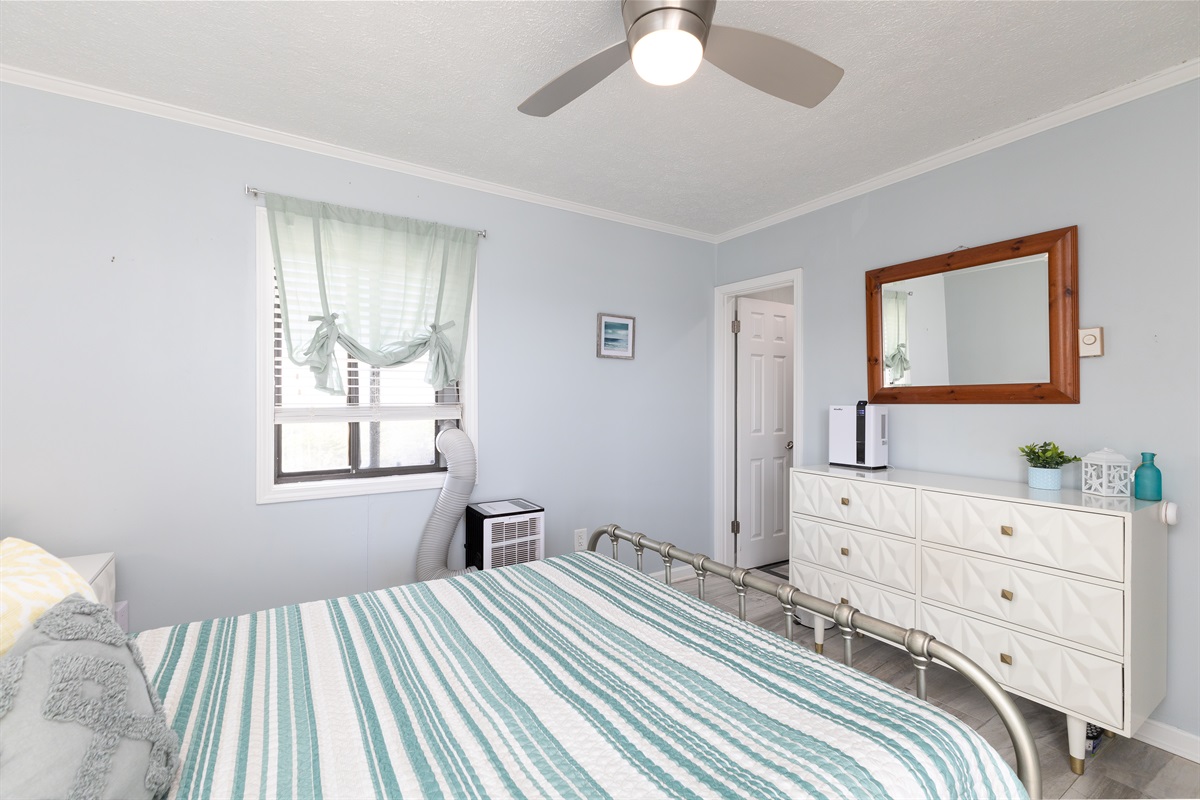 Bed, mirror, and a cozy decor